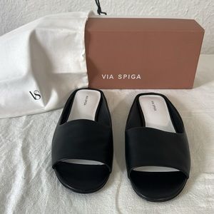 Via Spiga black leather flat slides.